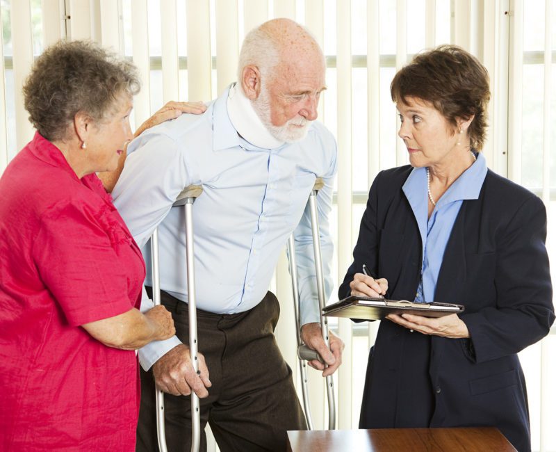 man injured in accident talking with Personal injury Lawyer